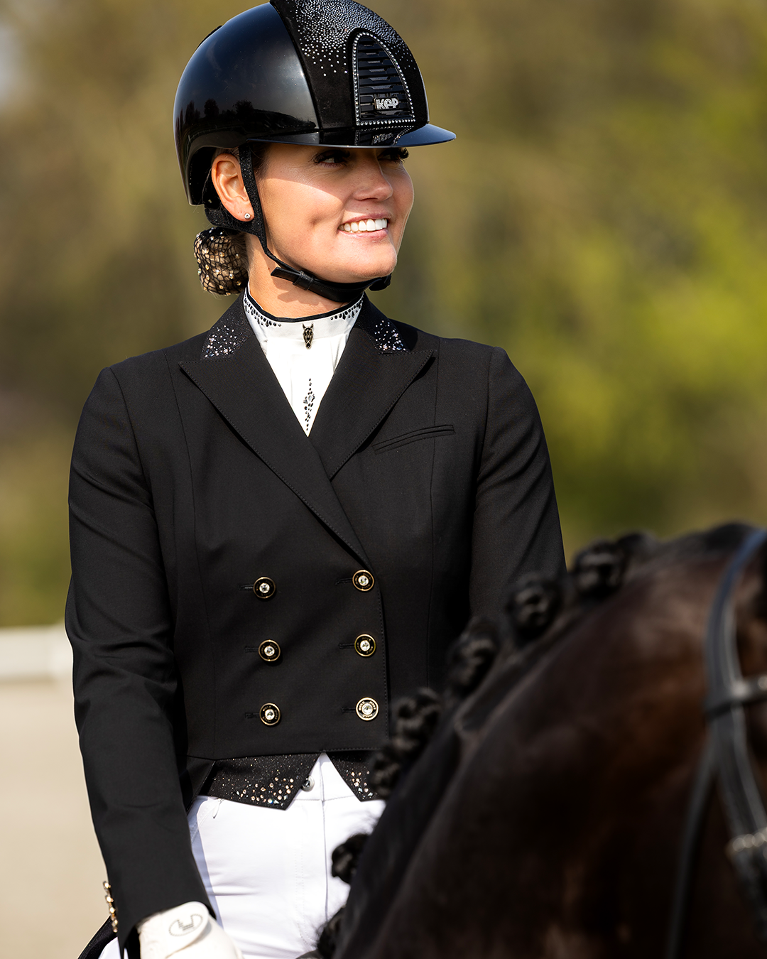 Frontal view of ladies' shadbelly with glitter fabric accents and Swarovski crystals on the collar and under the buttons