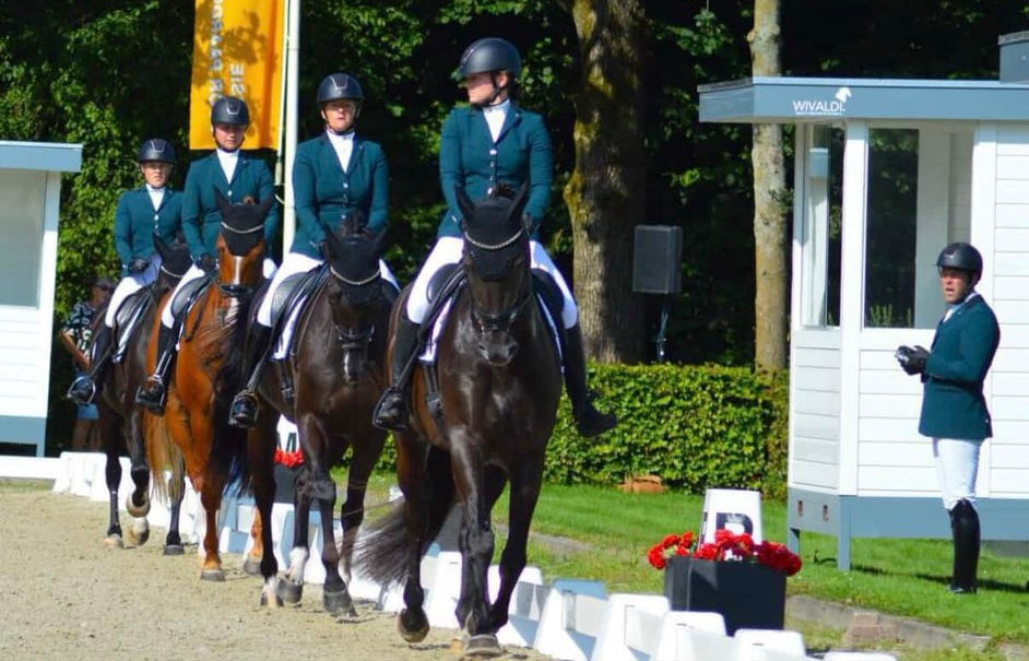 Quadrille showing their dressage test together, all wearing JuulC competition jackets