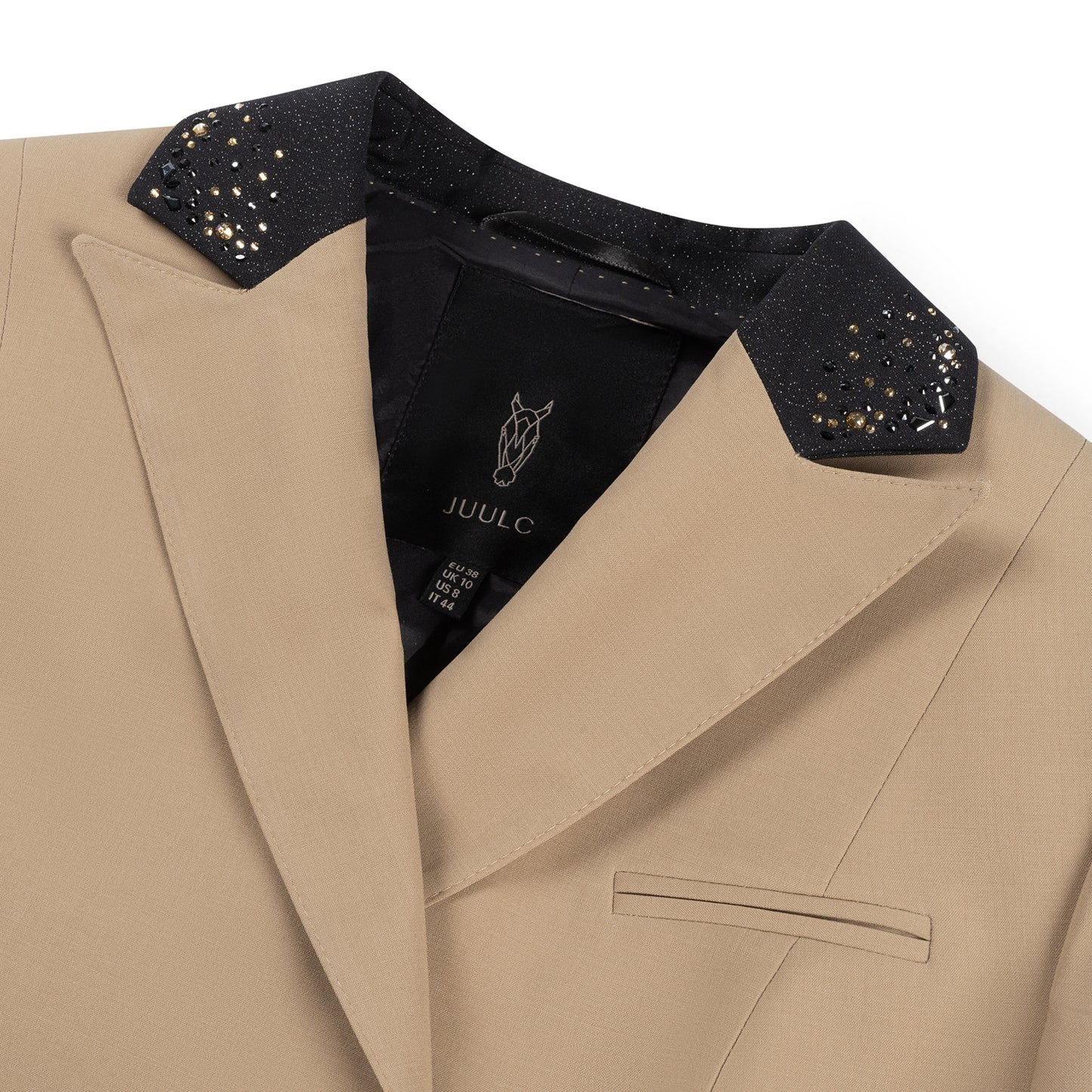 Detail of the collar of beige JuulC Women's Competition Jacket in Sand Sunset, with black glitter fabric and champagne gold Swarovski crystals