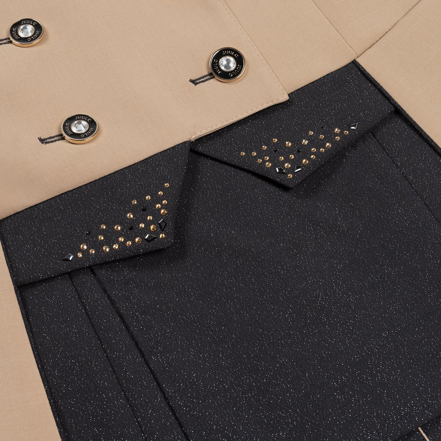 Detail of the black glitter fabric on the inserts and inside the skirt of JuulC Women's Dressage Frack in Sand Sunset